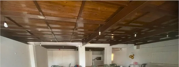 Open interior with a timber ceiling