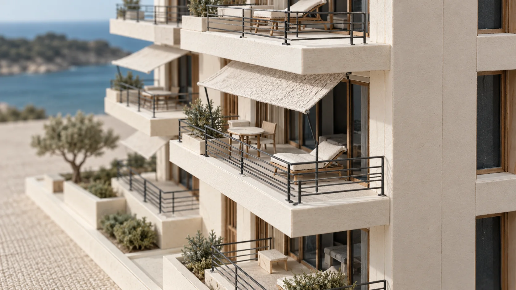 Model balconies with charcoal railings and linen awnings