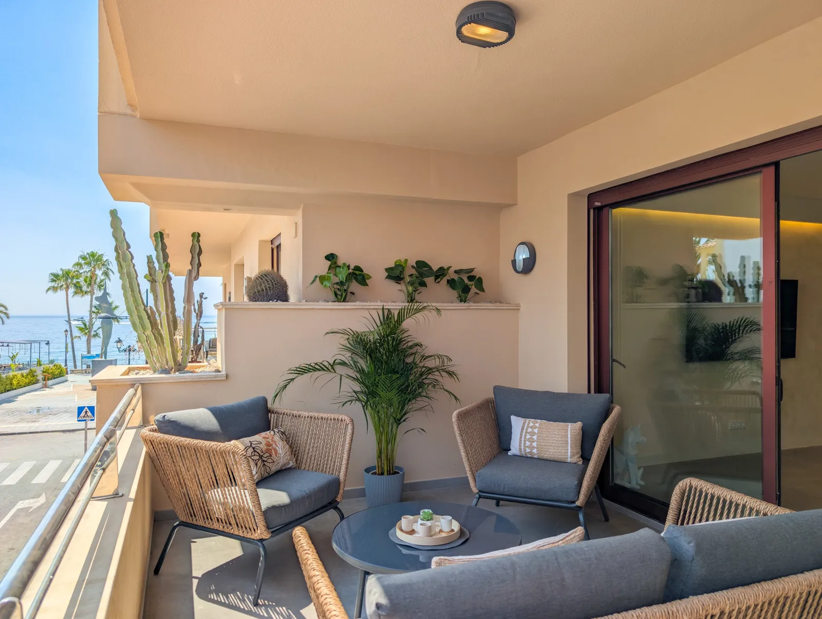 The apartment terrace with a view toward the sea