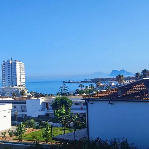 View over the rooftops to the sea and the Rock of Gibraltar
